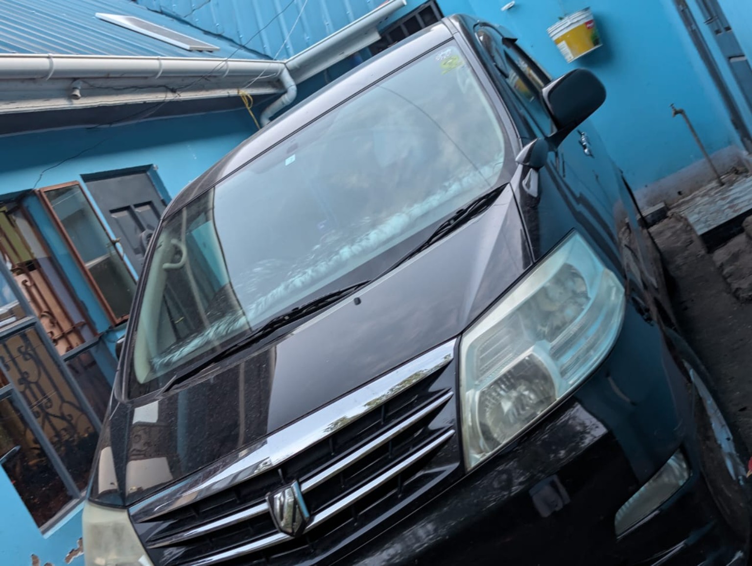 Front view of the black Royal Alphard transfer vehicle